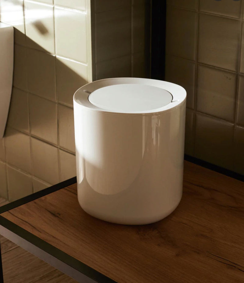 White Alessi waste bin with self-sealing lid.