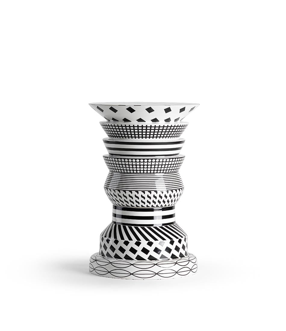 Two-sided "Regina" side table adorned in a variety of black and white patterns.