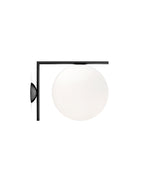 Flos IC Lights Ceiling/Wall sconce. Black L-shaped body connected to opaque white glass spherical diffuser.
