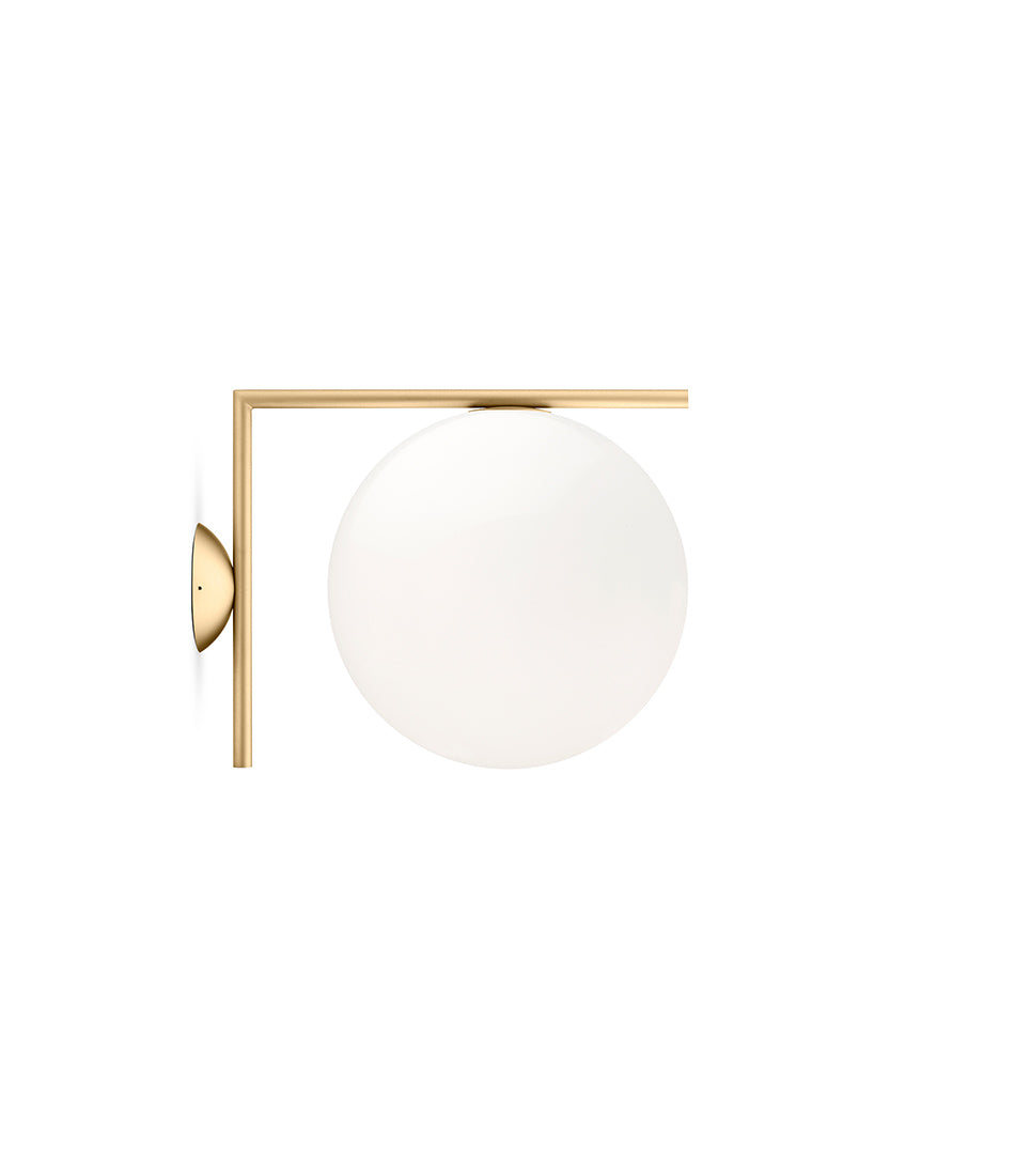 Flos IC Lights Ceiling/Wall sconce. Brass L-shaped body connected to opaque white glass spherical diffuser.