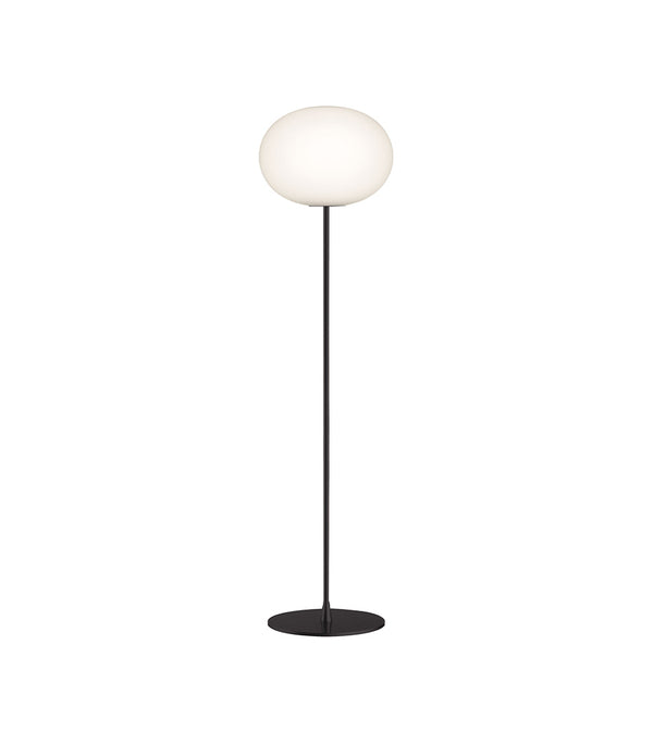 Flos Glo-Ball floor lamp, with large opaque white glass spherical diffuser, black stem and base.