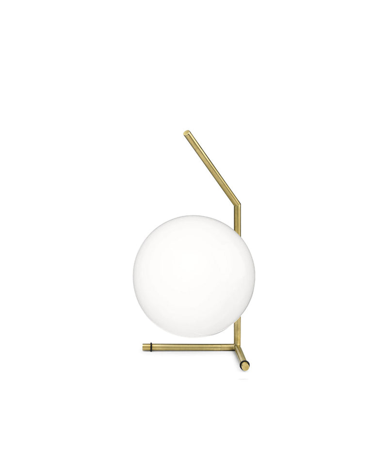 Flos IC Lights T1 Low table lamp, with spherical white diffuser attached to angular brass bar and bipod base.