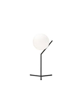 Flos IC Lights T1 High table lamp, with spherical white diffuser attached to angular black bar and tripod base.