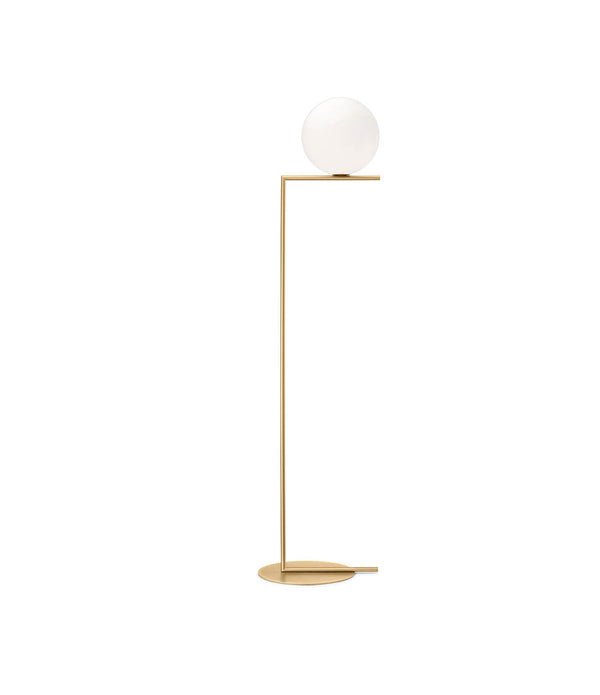 Flos IC Lights Floor Lamp, with opaque white glass spherical diffuser mounted atop an L-shaped brass stem.