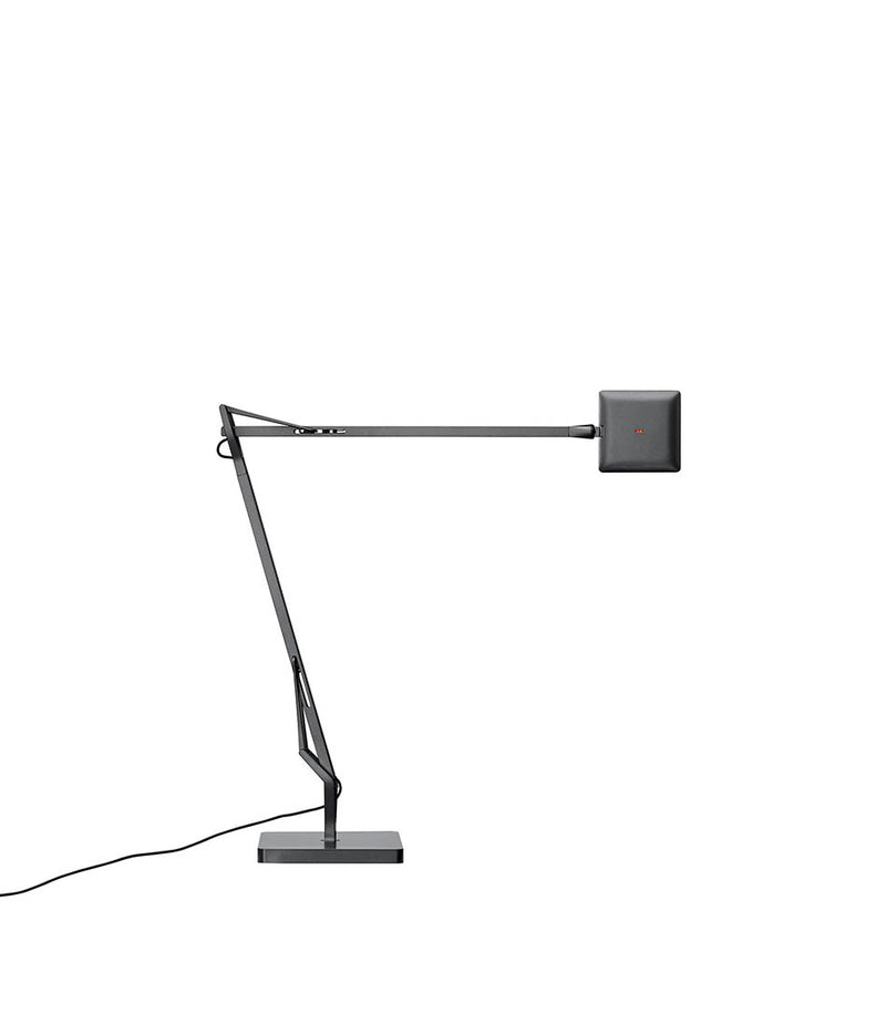 Titanium Flos Kelvin Edge table lamp, with double-jointed stem and flat multi-directional LED head.