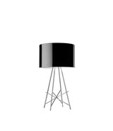 Flos Ray table lamp. Glossy black shade atop four chrome legs.