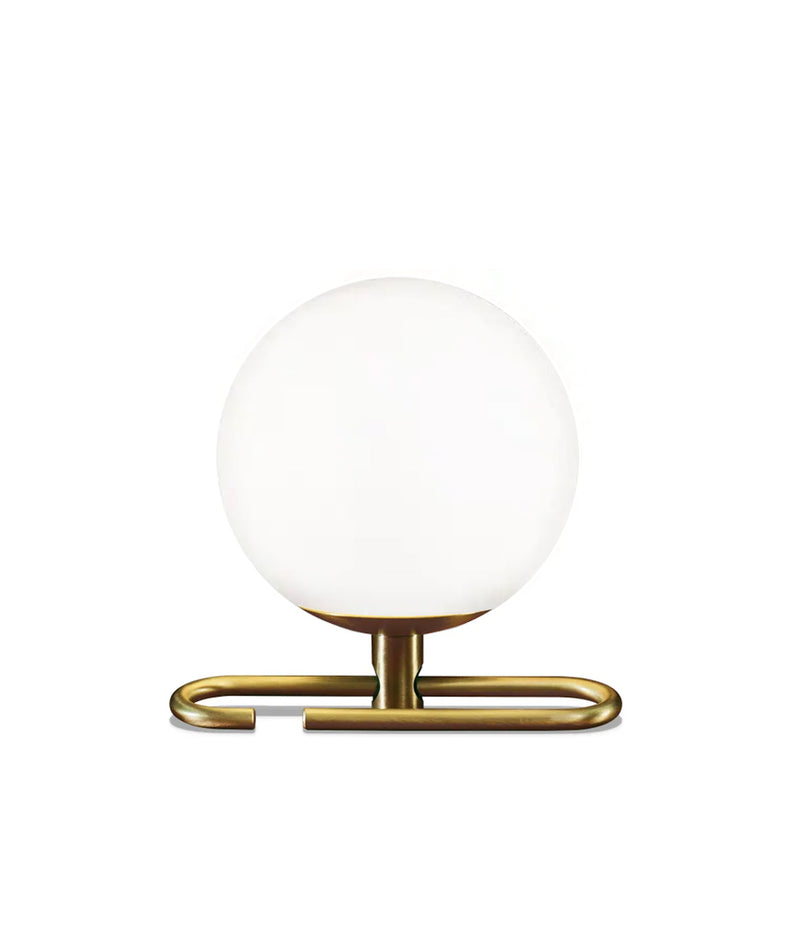 Artemide NH table lamp, with spherical blown glass shade and brass oval ring base.