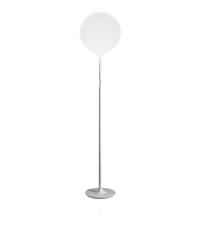 Artemide Castore lamp, with a slender stem and large round glass opal diffuser.