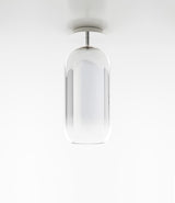 Pill-shaped Artemide Gople ceiling lamp, with blown glass diffuser in gradient silver.