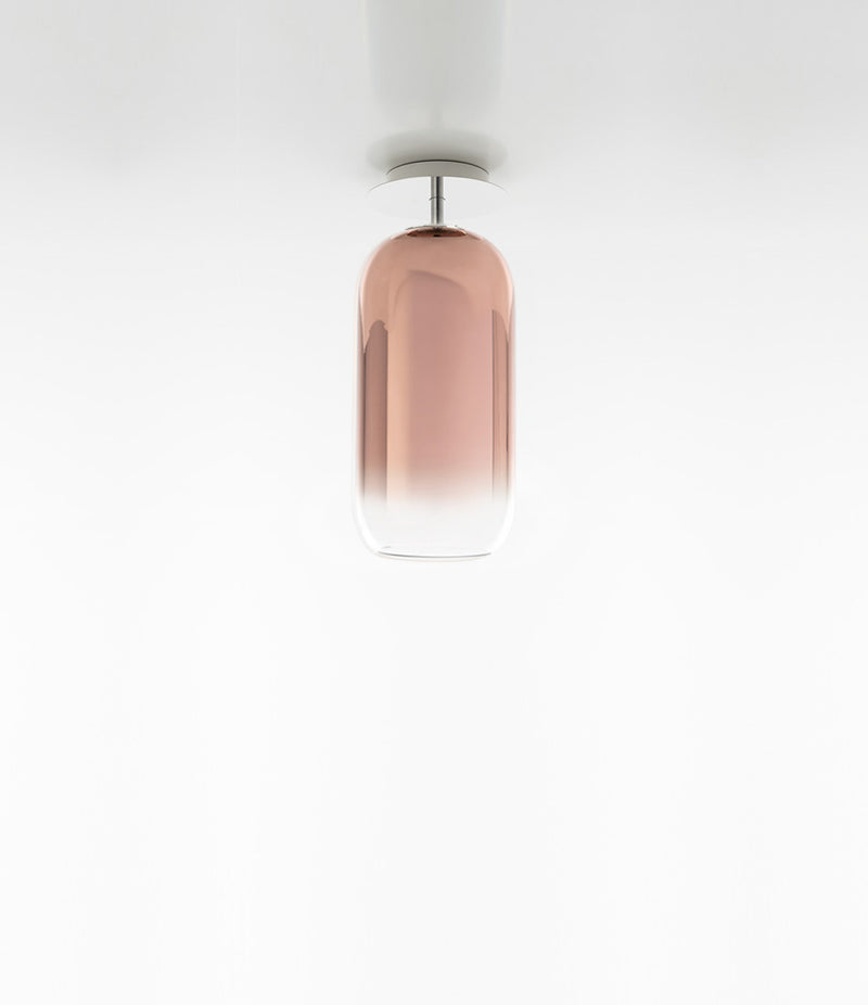 Artemide Gople Mini ceiling lamp, with pill-shaped blown glass shade in gradient copper.