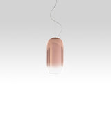 Artemide Gople Mini suspension light, with pill-shaped blow glass shade in gradient copper.