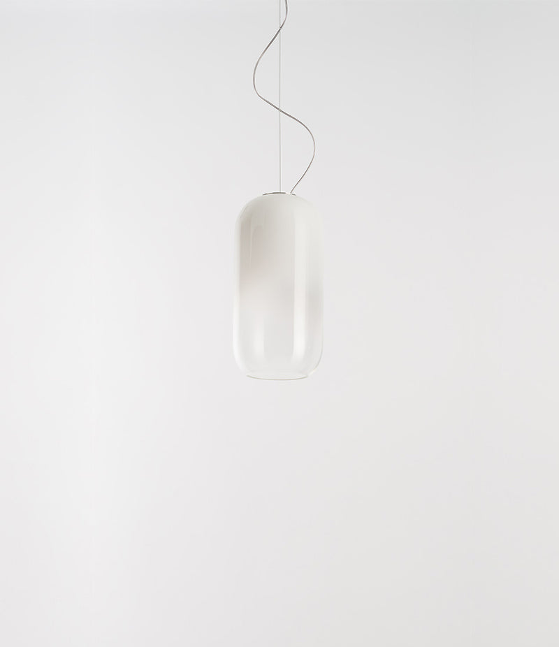 Artemide Gople Mini suspension light, with pill-shaped blow glass shade in gradient white.