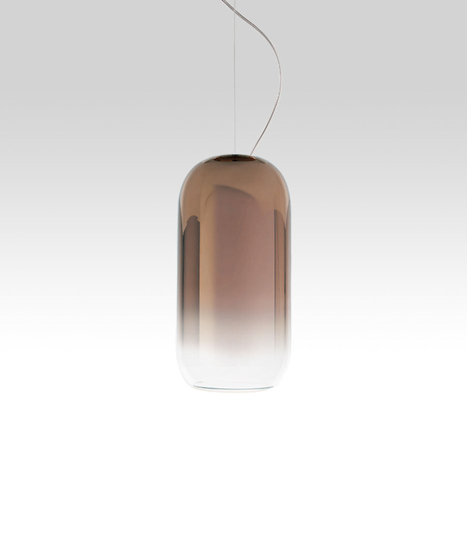Pill-shaped Artemide Gople suspension lamp, with blown glass shade in gradient bronze.