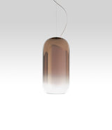 Pill-shaped Artemide Gople suspension lamp, with blown glass shade in gradient bronze.