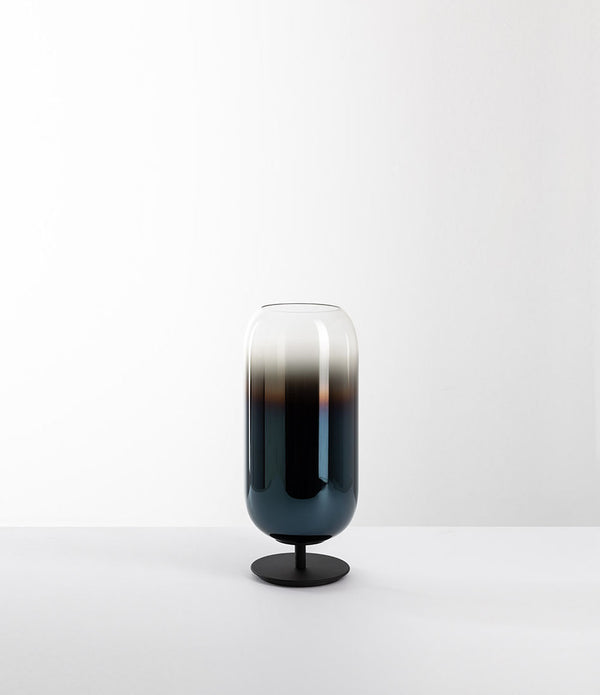 Artemide Gople Mini table lamp, with black steel base and blown glass pill-shaped shade in gradient blue.