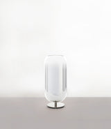 Artemide Gople Mini table lamp, with chrome steel base and blown glass pill-shaped shade in gradient silver.