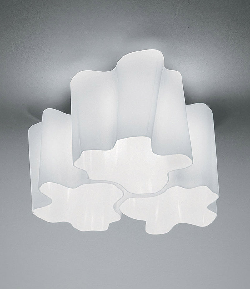 White Artemide Logico Triple nested ceiling lamp mounted to ceiling.