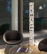 Artemide New Nature floor lamp in a living room next to two lounge chairs.