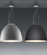 Two standard Artemide Nur suspension lamps hang from the ceiling side by side.