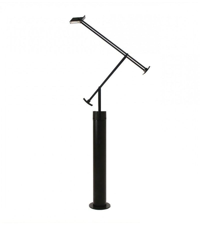 Artemide Tizio floor lamp, a double elbowed arm mechanism atop a thick cylindrical base.