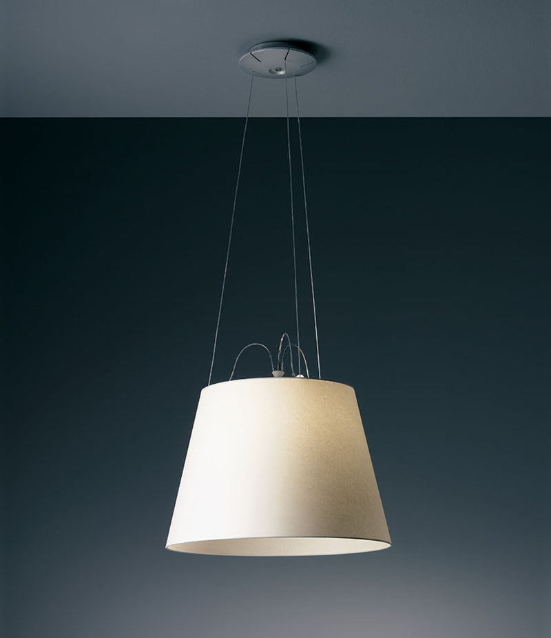 Artemide Tolomeo Mega suspension lamp in parchment shade, hanging from ceiling.