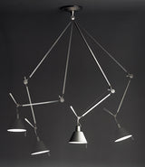 Photograph showing four different position capabilities of Artemide Tolomeo Off-Center suspension lamp.