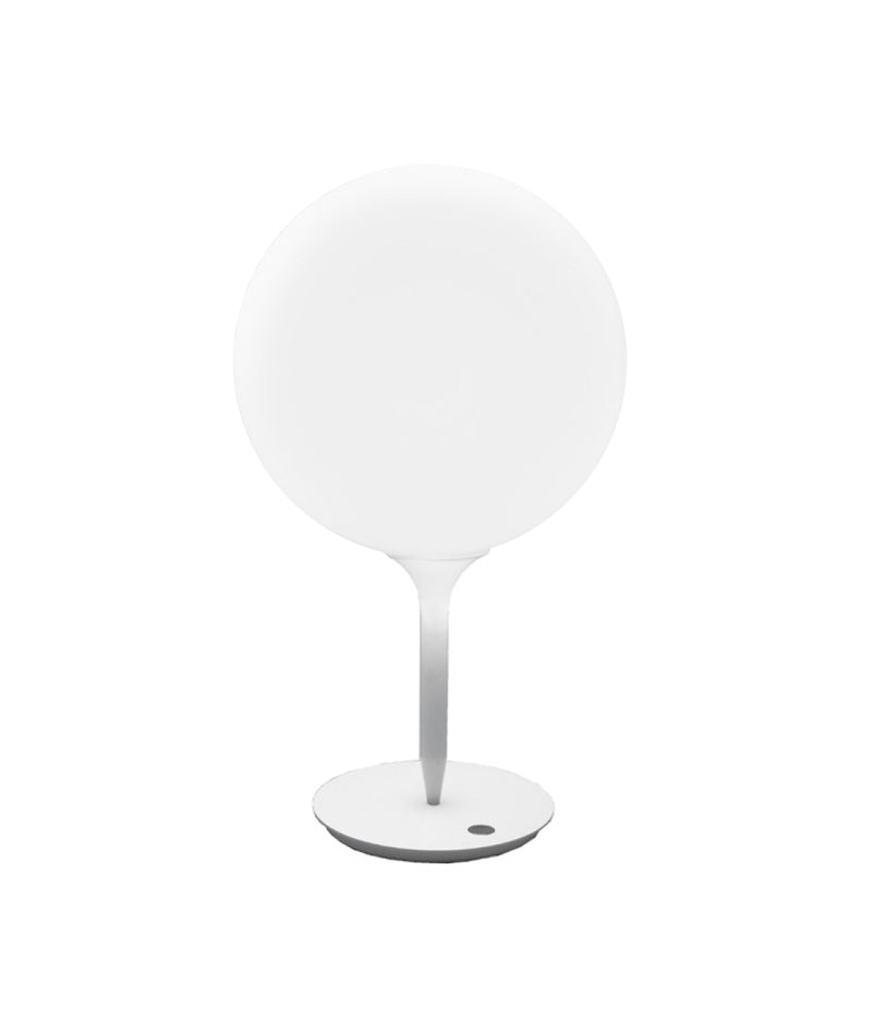Artemide Castore table lamp with spherical hand-blown glass diffuser.
