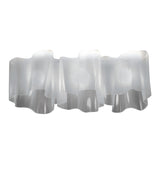 Artemide Logico Triple ceiling lamp in milky white finish. Blown glass diffuser shaped into folded pattern.