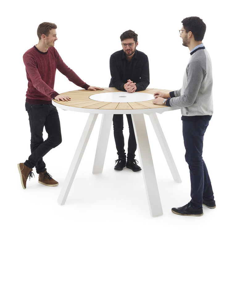 Three people stand around Extremis Pantagruel high table.