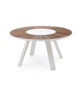 Extremis Pantagruel table with dark Hellwood slat tabletop and white lazy Susan. Four independent legs make up the base.