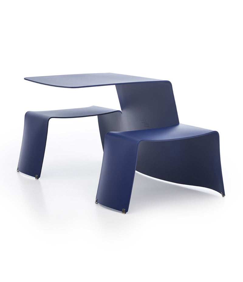 Extremis Picnik table in cobalt blue finish. Tabletop is connected on one side to two bench seats.