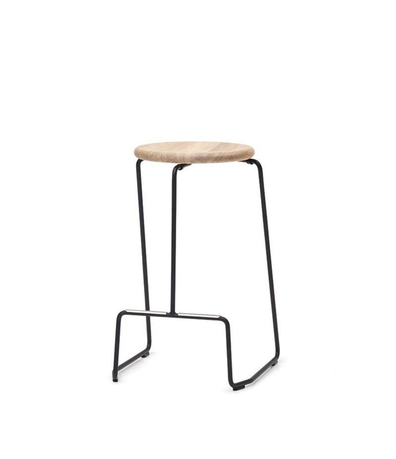 Extremis Tiki stackable counter stool, with oak circular seat atop black wire frame.