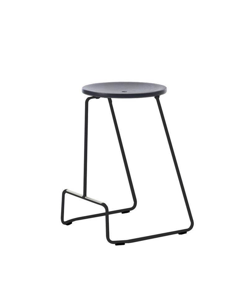 Extremis Tiki stackable counter stool, with black circular seat atop black wire frame.