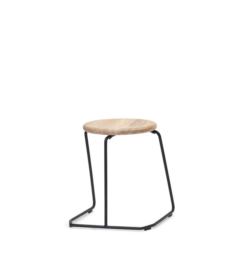Extremis Tiki Stackable low stool, with oak circular seat atop black wire frame.