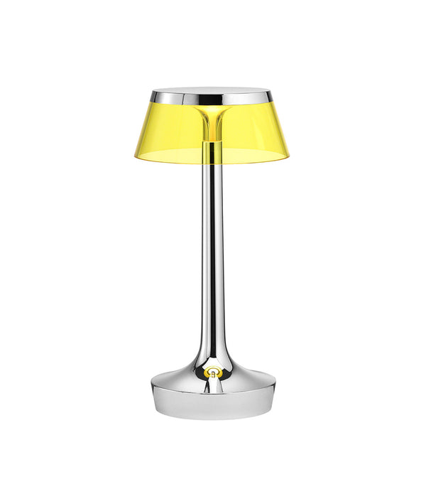 Flos Bon Jour Unplugged portable table lamp, with chrome stem and yellow crown.