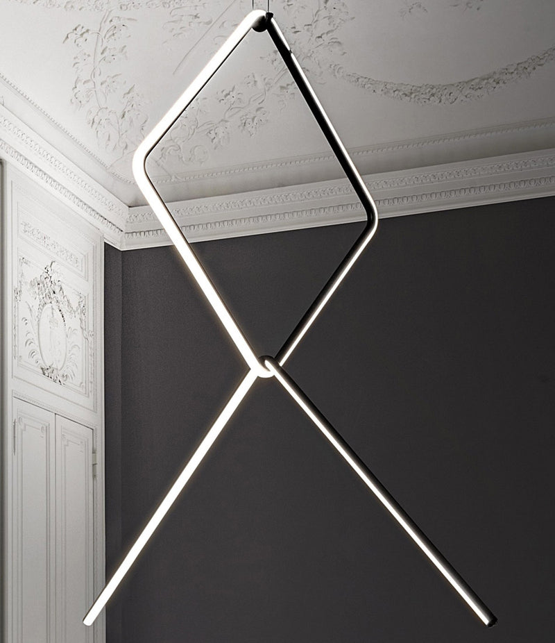 Flos Arrangements Pendant Light 4 hanging from an engraved ceiling. 