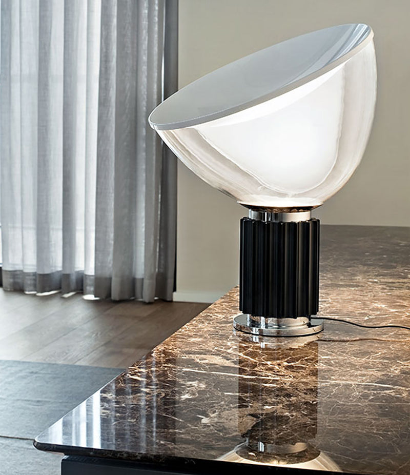 Flos Taccia table lamp on marble sideboard.