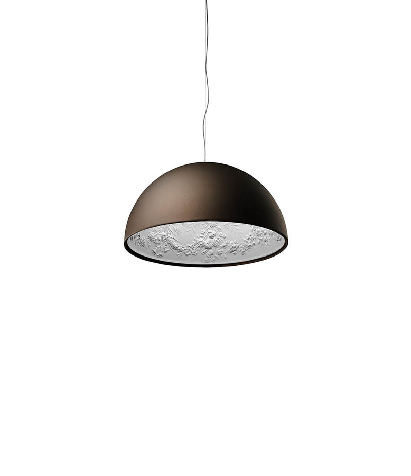 Brown Flos Skygarden suspension lamp, with raised ornate floral patterns on the inside of the bowl shade.