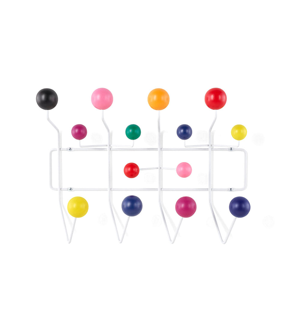 Wall mounted Herman Miller clothing hangar system with white frame and multi-coloured ball hooks.